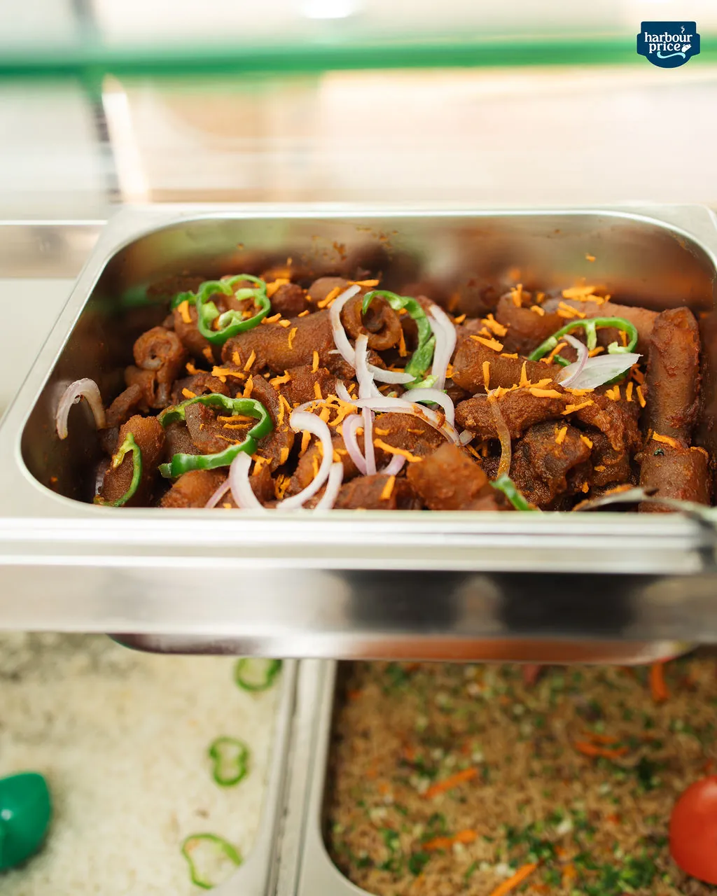 A tray of chicken stew at the Harbour Price Hot Meals counter