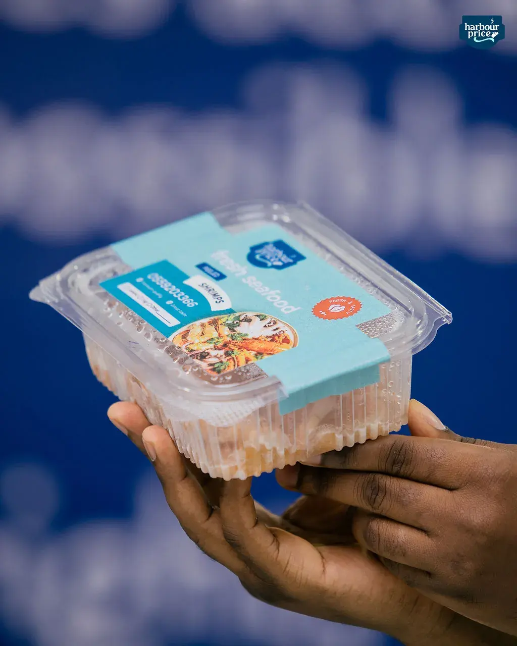 The mixed seafood pack tilted to show the contents through the clear lid